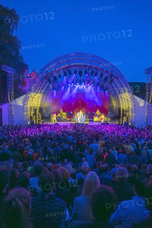 Cheering crowd at Live Klostersommer Festival in Historic Monastery