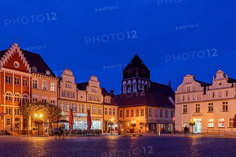 Architecture on the historic market square with town houses and St. Mary's Church at the blue hour