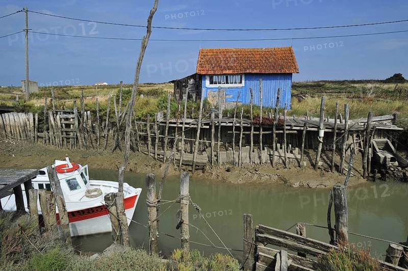 Colourful cabins of oyster farm at la Baudissiere near Dolus