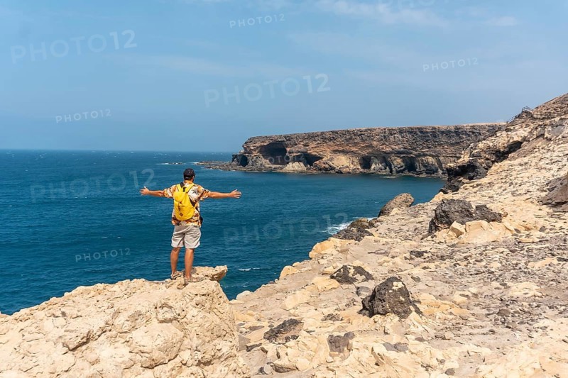 A young tourist on the trail heading to the caves of Ajuy