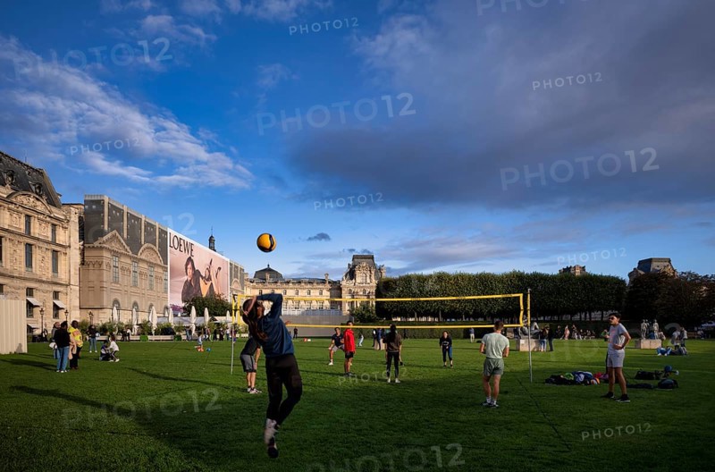 Young people playing volleyball