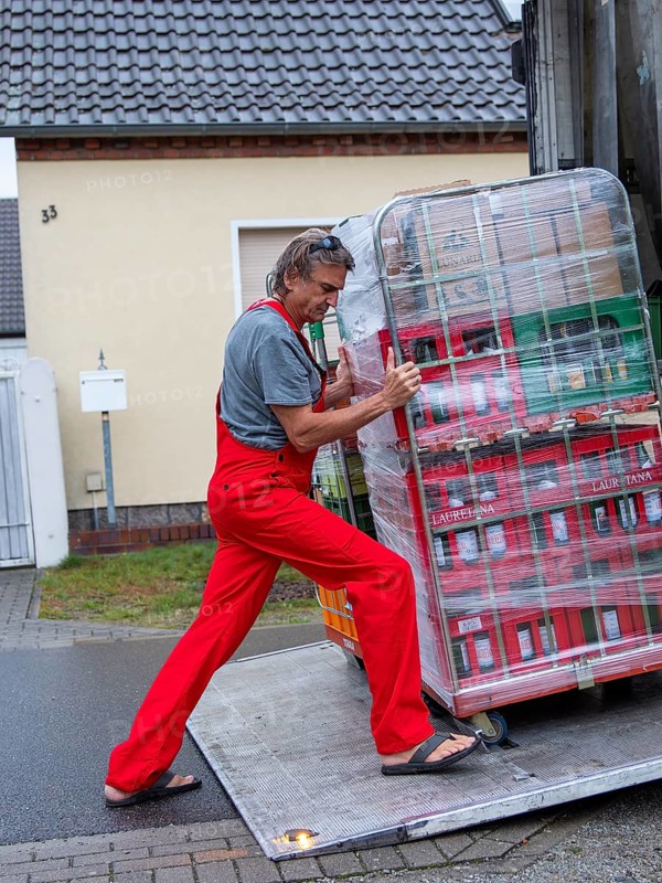 Man at loading ramp truck
