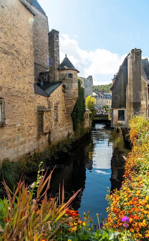 Traditional wooden houses by the river in the medieval town of Quimper in the department of Finisterre. French Brittany