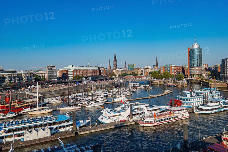 View from a cruise ship of harbour cruise ships and the Niederhafen at the Ueberseebruecke of the Port of Hamburg