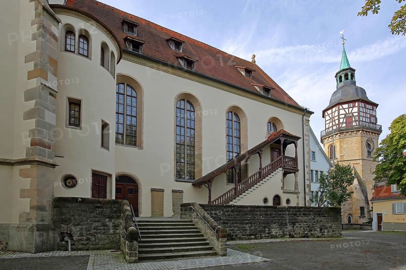 Late Gothic collegiate church of St. Pancratius with exterior staircase and historic town tower landmark