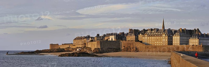 View over the walled city Saint-Malo from mole at sunset