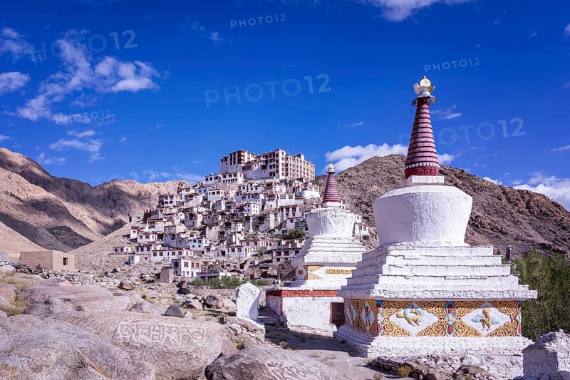 Stupas in front of Chemrey Gompa