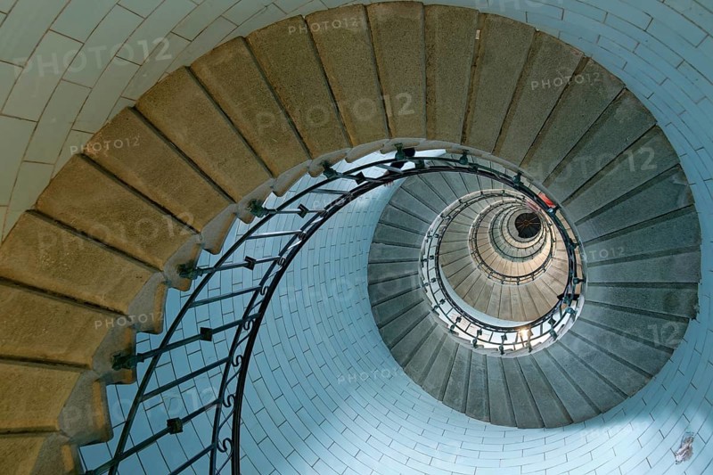 Spiral staircase inside the Phare d'Eckmuehl lighthouse in Penmarch. Brittany
