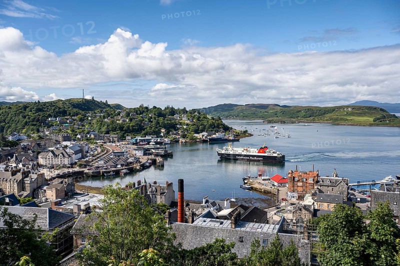 View over the harbour town of Oban to the ferry harbour with the ferry Isle of Lewis operating between Oban and Isle of Barra