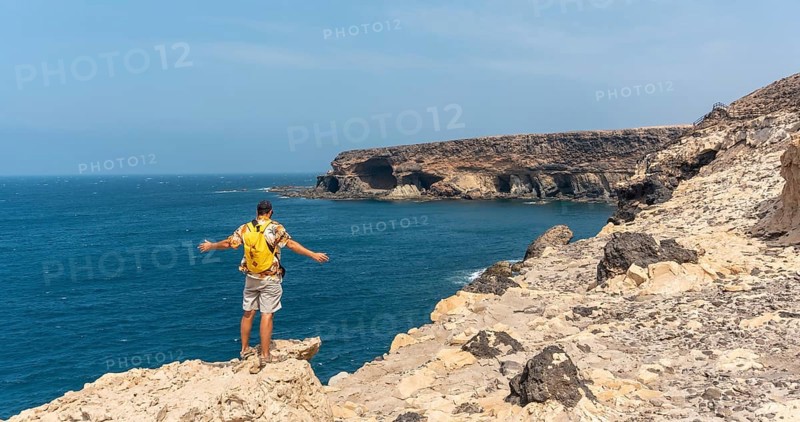 A young tourist on the trail heading to the caves of Ajuy