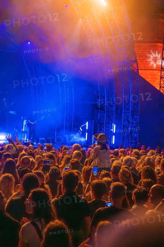 Crowd at Live Klostersommer Festival in Historic Monastery in front of stage