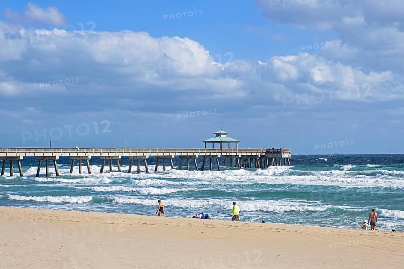 Stormy weather and pier in winter at Surfside Beach along the Atlantic Ocean in Miami-Dade County