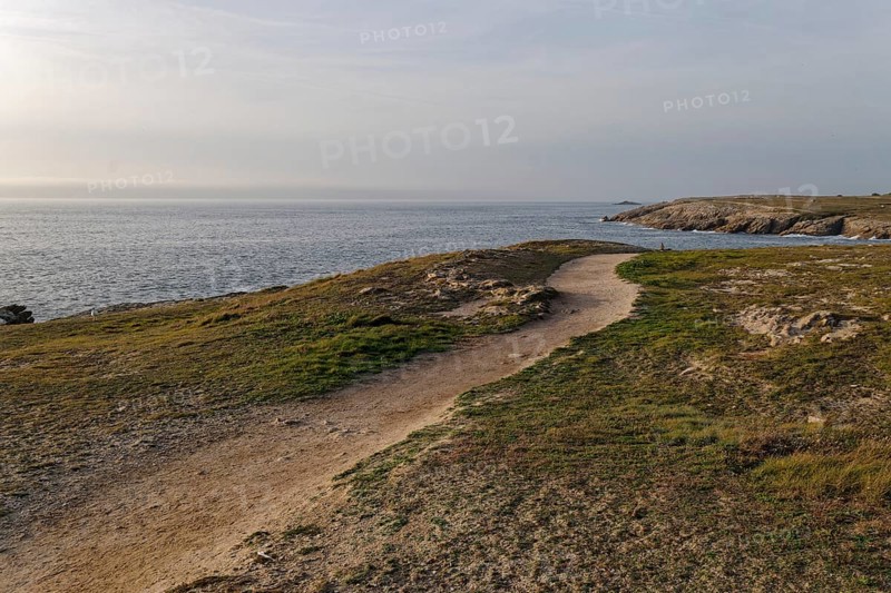 Hiking trail on the Cote Sauvage. The Wild Coast is a rocky coast on the west side of the Quiberon Peninsula in Brittany. Cores