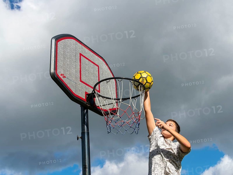 Basketball Jump with the ball to the basket and net