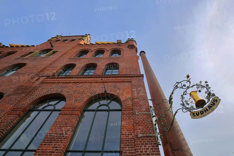 Red brewhouse with chimney and nose shield