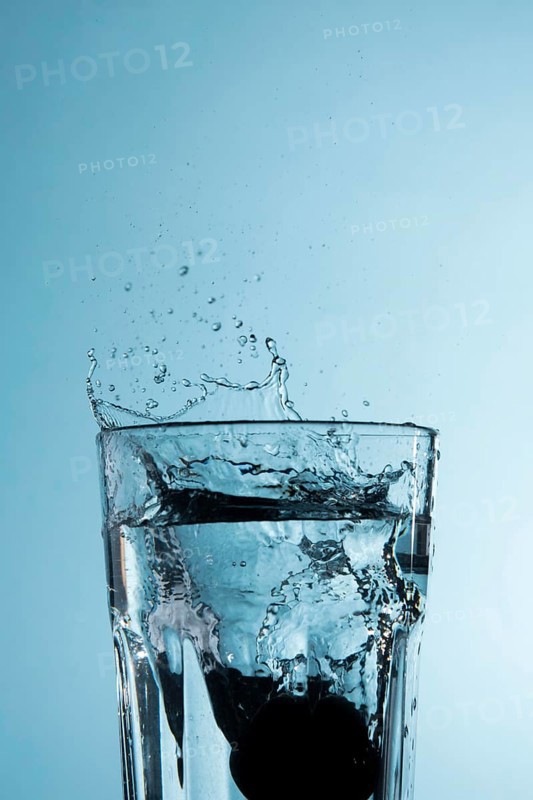 Clear glass with splashing water