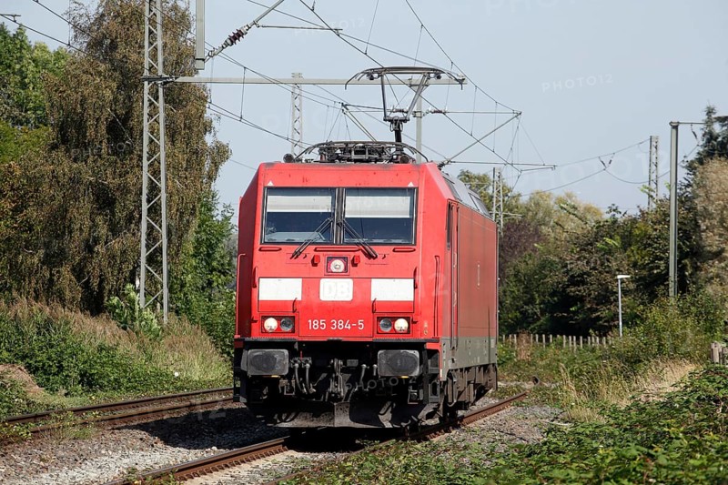Red locomotive class 185 on a railway track