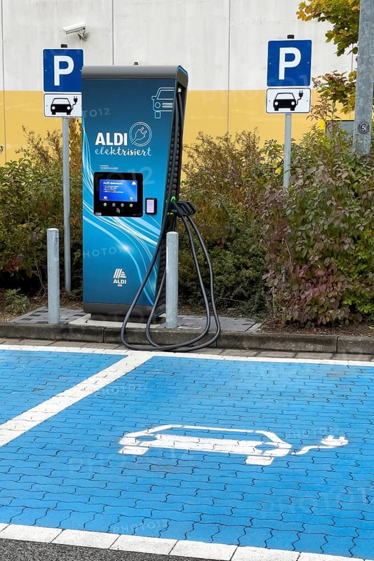 Charging station for e-car in front of supermarket of supermarket chain Aldi Sued next to it traffic sign Parking spaces for two e-cars can be charged