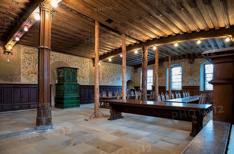 Interior view of winter refectory with tiled stove