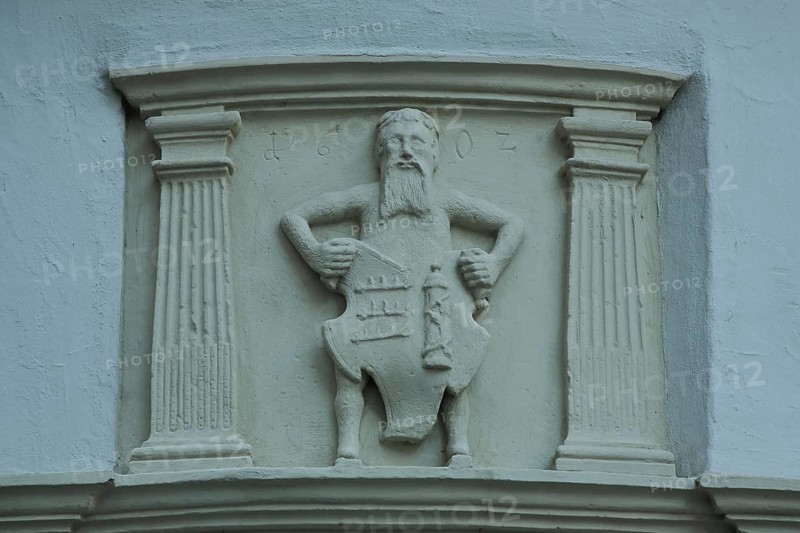 Figure with town coat of arms
