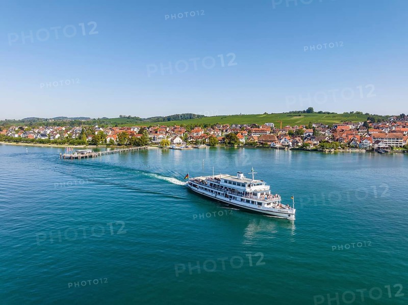 Aerial view of the Lake Constance municipality of Hagnau with the landing stage and the departing scheduled ship MS Swabia of the Lake Constance-Schiffsbetriebe