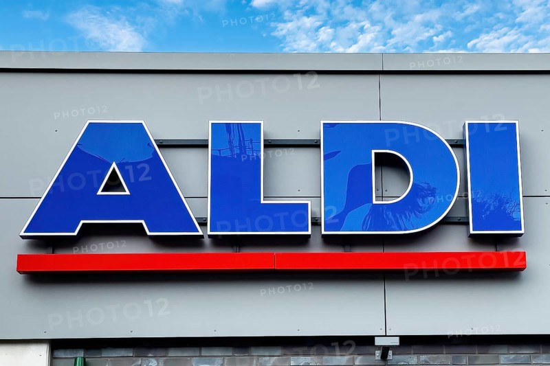 Logo lettering Aldi in blue with red underline on wall of supermarket of supermarket chain retail chain Aldi Nord