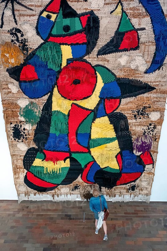 Visitor in front of a tapestry at Joan Miro Foundation