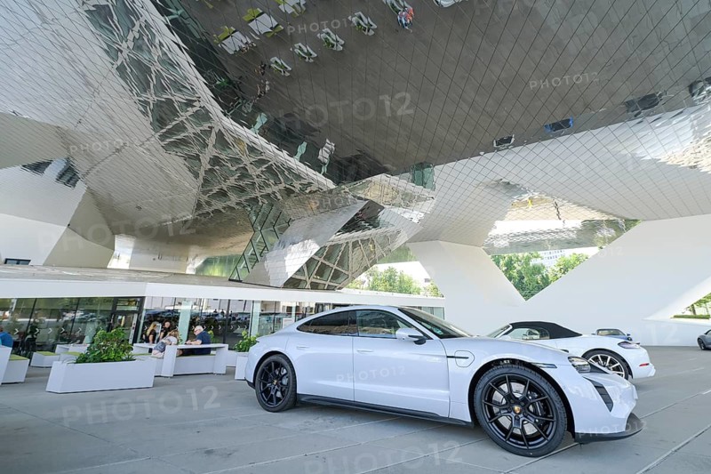 Porsche cars parked in front of the Porsche Museum