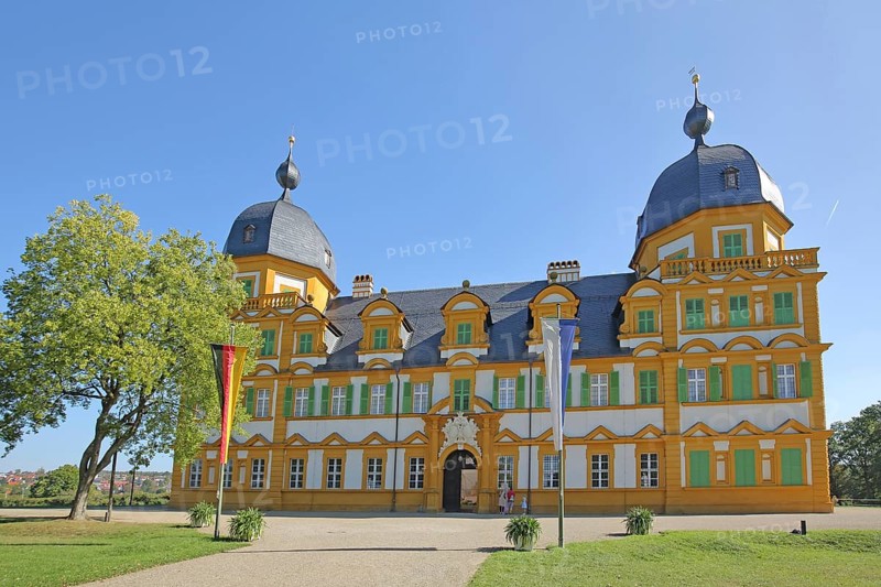Baroque Seehof Castle with German national flag and Bavarian state flag