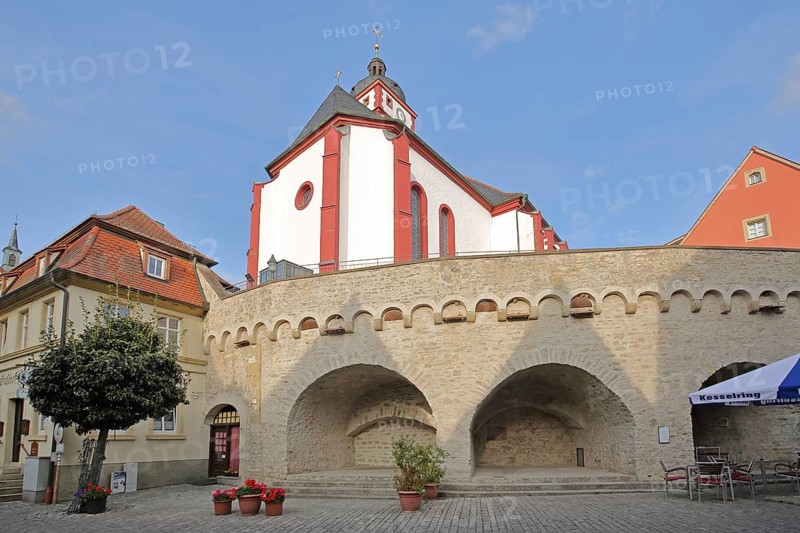 Stone wall with archways and St. Augustine's Church