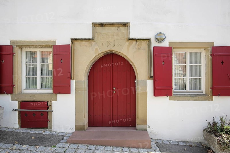 Entrance of the historic poorhouse with the year 1486