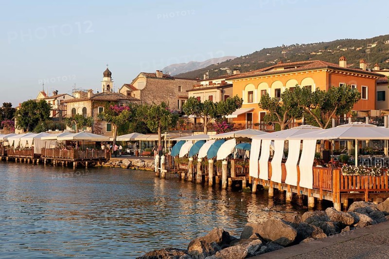 Restaurant terraces with sunshades on the lakeshore