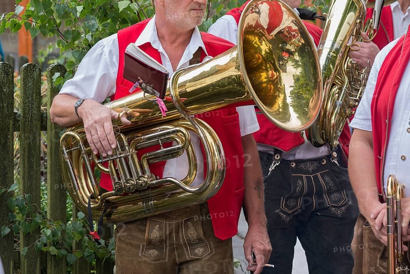 Musician holds his tuba ready to play