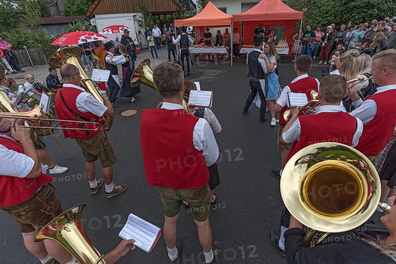 Dance of the Kirchweih couples with brass band on the street on the day of the traditional Tanzlindenfest