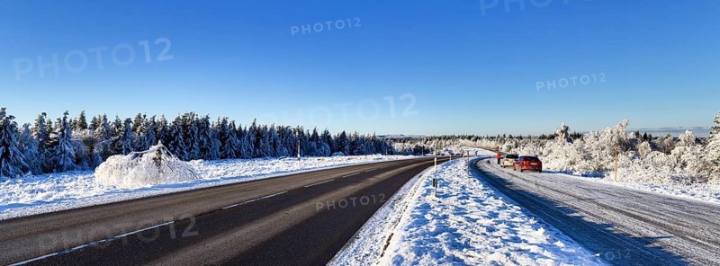 Snow-covered landscape and Black Forest High Road in winter near Baiersbronn