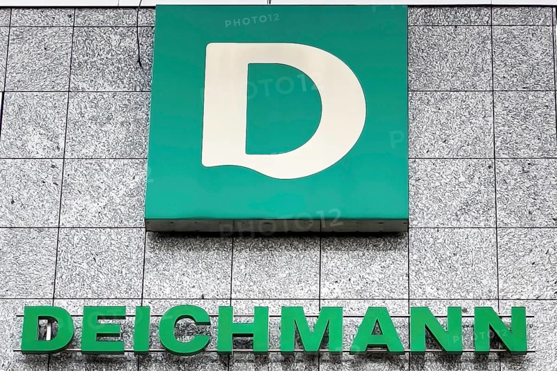 Logo of family business shoe manufacturer retail for shoes Deichmann below lettering on building with headquarters in Essen