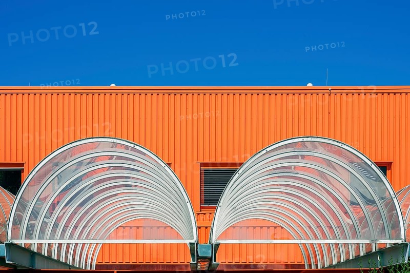 Orange facade and acrylic glass roofing