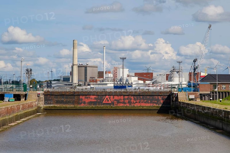 Sea lock in front of industrial harbour