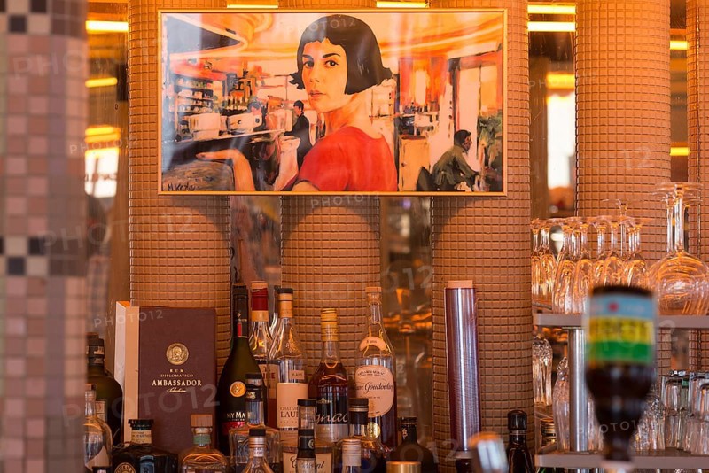 Poster above the bar in the Cafe des Deux Moulins