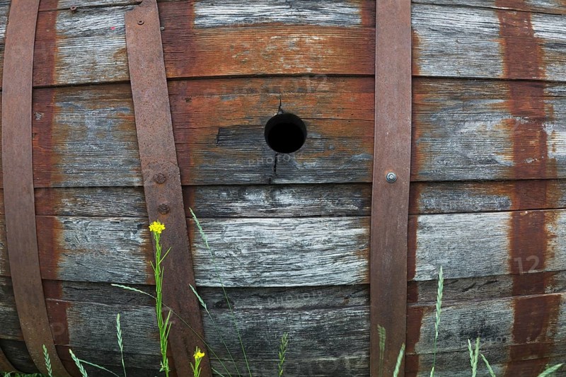 Old barrel made of wooden staves and metal hoops