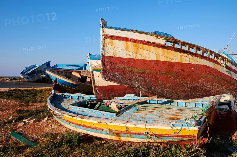 Colourful boats on top of each other