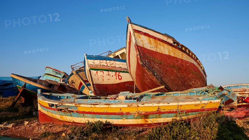Colourful boats above and next to each other