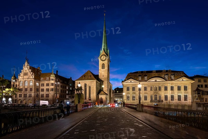 Fraumünster with Stadthaus and Münsterhof from Münsterbrücke at dusk
