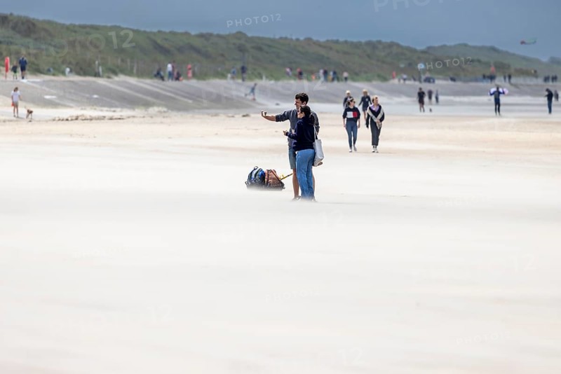 Sand kicked up during storm on the North Sea coast in De Panne
