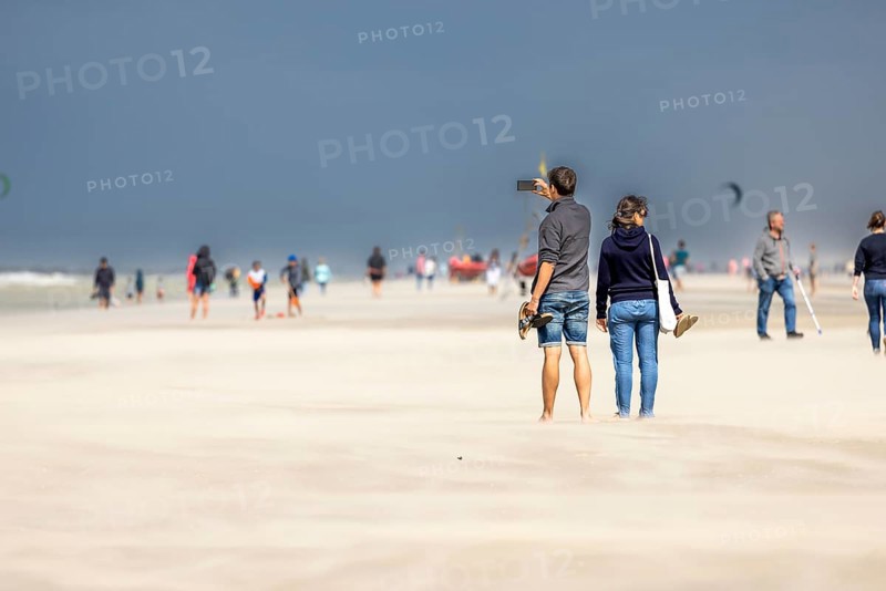 Sand kicked up during storm on the North Sea coast in De Panne