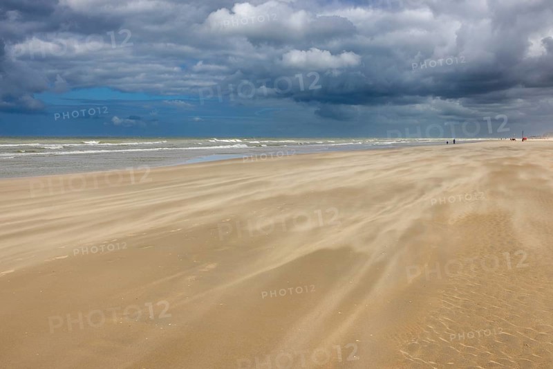 Sand kicked up during storm on the North Sea coast in De Panne