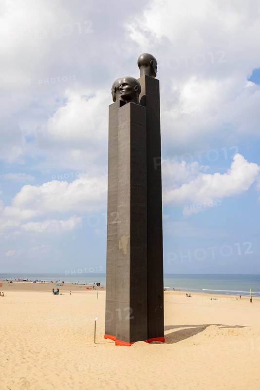 The sculpture The Three White Noses on the beach of De Panne