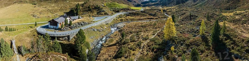 Colourful larches and mountain panorama