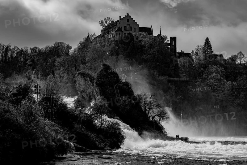 Rhine Falls and Swiss Flag with the Castle Laufen at Neuhausen
