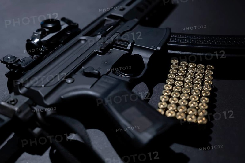 Modern Elegant Assault Rifle and Bullet on Grey Background in Switzerland